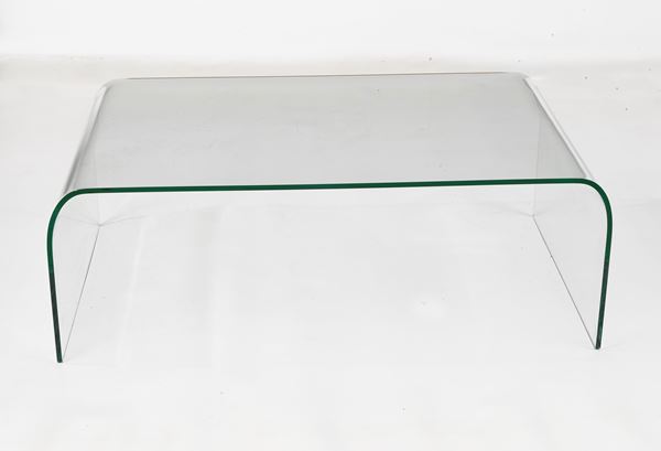 Curved glass bridge coffee table, branded FIAM ITALY - Pesaro, designed by designer Vittorio Livi, founder of the Fiam company that in the 70s, began producing curved glass furniture. Some small scratches and a small chip on one edge