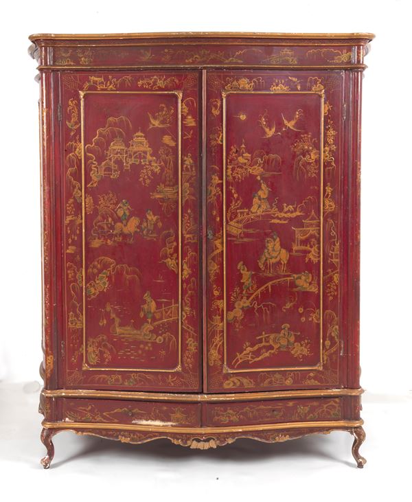 Red lacquered wooden wardrobe with &quot;Oriental life scenes&quot; motif decorations with gilded wooden profiles, two doors, two drawers underneath and four curved legs. Slight defects