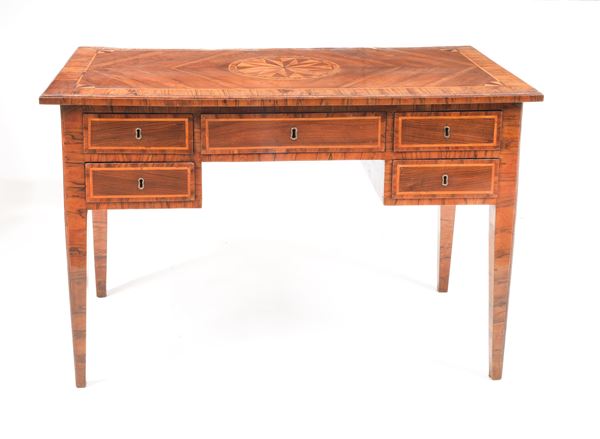 Antique Neapolitan Louis XVI center desk, in walnut, olive root and boxwood, with top inlaid with a central rosette motif and fillets, five drawers underneath and four inverted pyramid-shaped legs