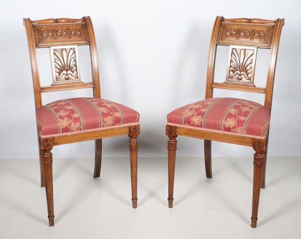 Pair of Tuscan chairs from the Carlo X line, in pickled wood with carved and perforated backrests, red floral fabric covering