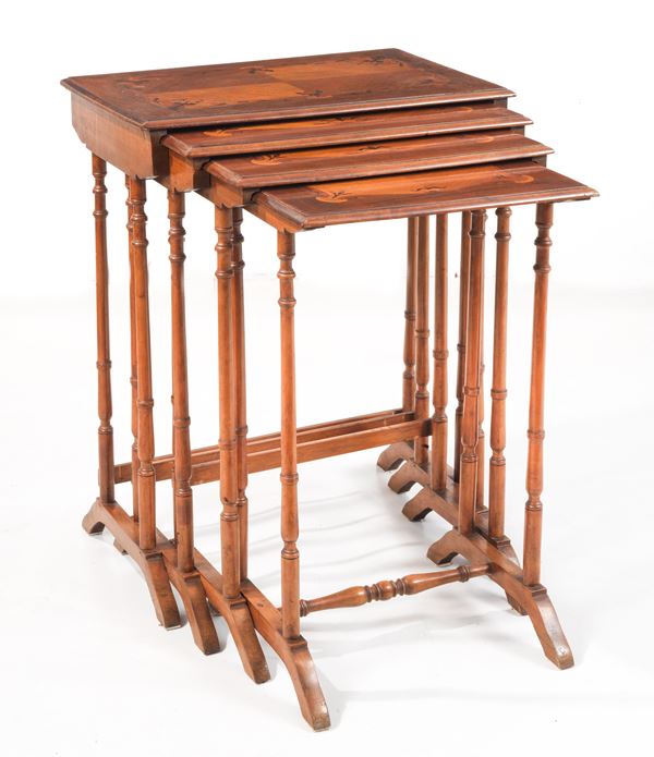 Antique nest of four tables in rosewood and blond mahogany, with tops inlaid with floral interlacing motifs