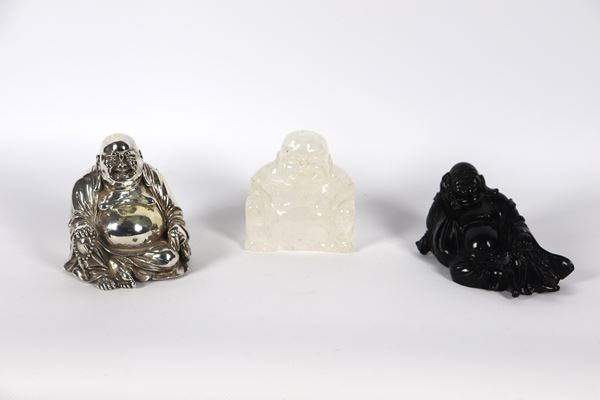 &quot;Buddha&quot;, lot of three sculptures: one in jade, one in hard stone and one covered in 925 silver