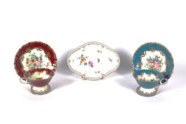 Antique polychrome porcelain lot decorated with flower bouquets of two French cups with saucers and an oval bonbon holder marked KPM Berlin. Chip on the rim of the burgundy cup