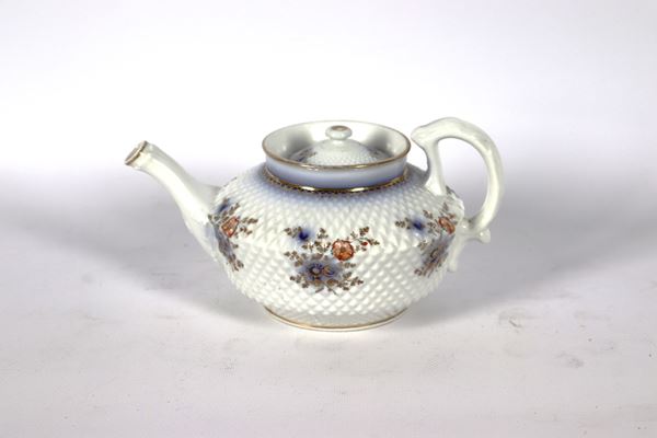 Antique teapot in honeycomb-worked enamelled porcelain, with multicoloured flower bouquet decorations on a white background