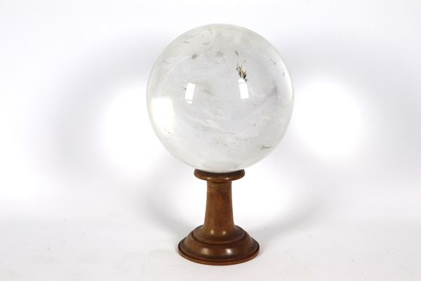 Rock crystal sphere with walnut column base