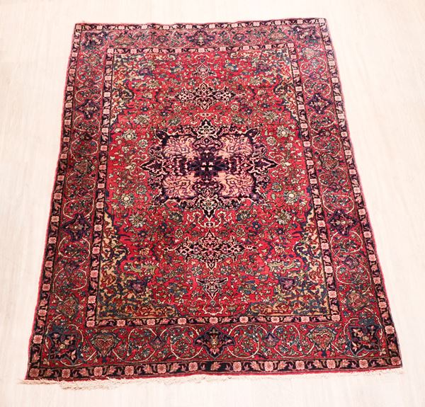 Persian Tabriz rug with geometric floral design on red and brown background