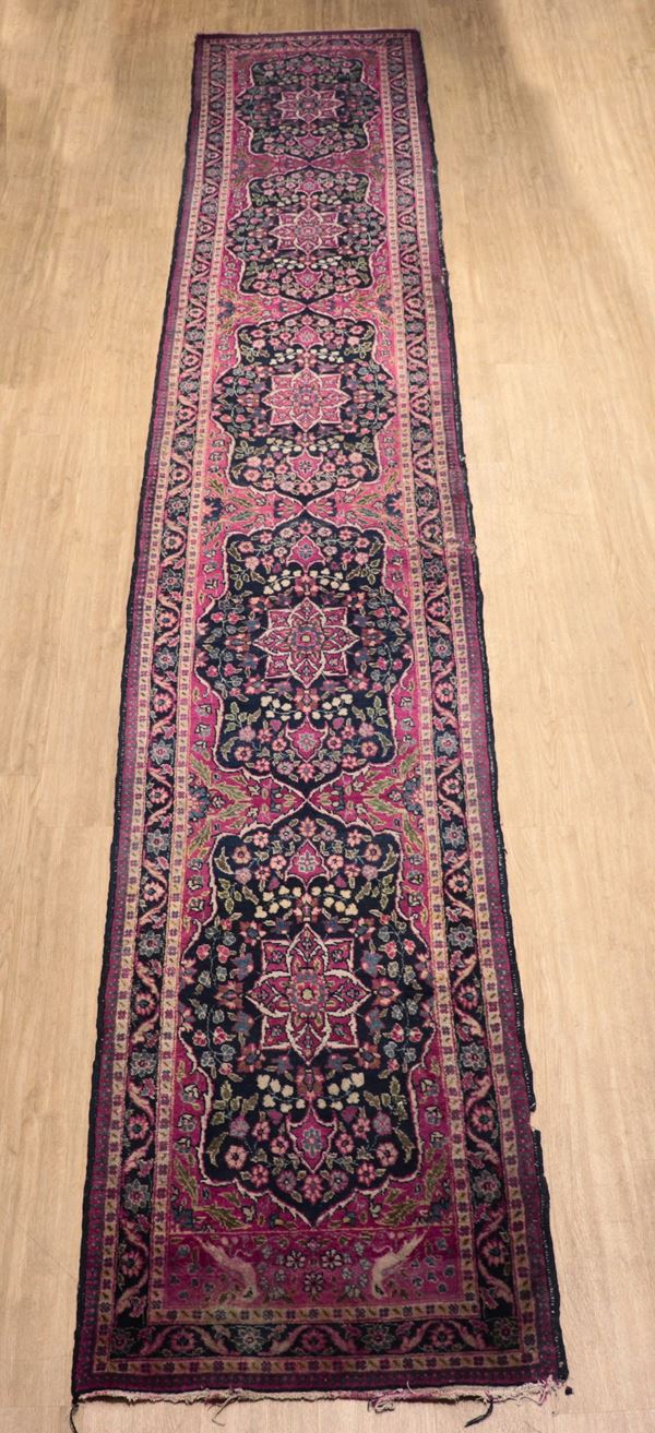 Persian Karadagh runner carpet with floral geometric design on red background, various defects