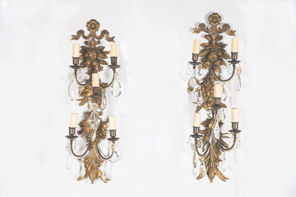 Pair of French Wall Lamps in gilded and burnished bronze, chiseled and embossed with fruit and grape motifs, with crystal prisms and pendants, 5 lights each. Old Manufacture