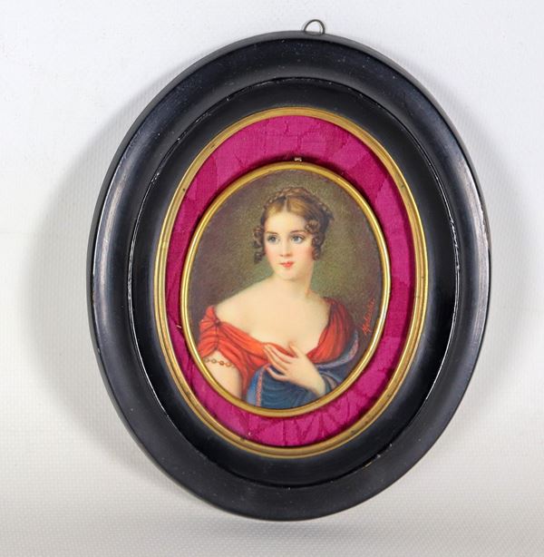 &quot;Portrait of a young noblewoman&quot;, painted oval miniature signed Melocchi, in an ebonized wooden frame