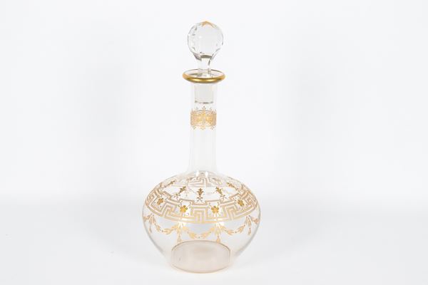 Crystal wine bottle with golden Empire motif decorations