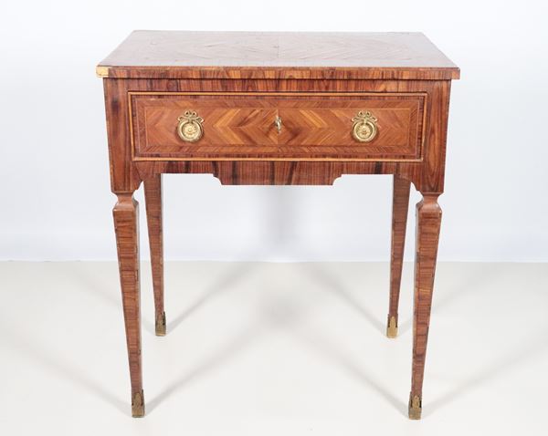 Antique rectangular centre table in walnut, rosewood and olive root with inlaid fillets, a central drawer and four inverted pyramid-shaped legs