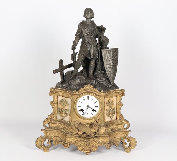 Antique burnished, gilded and chiseled bronze table clock with sculpture of a knight in armour, white enamel dial and Roman numerals. Not working, to be overhauled