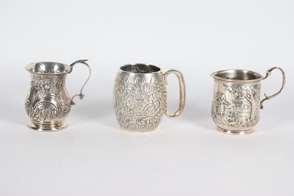 Lot of three small antique silver mugs, chiseled and embossed with landscape motifs, floral interweaving and scrolls. Late 19th - Early 20th Century, 235 gr.