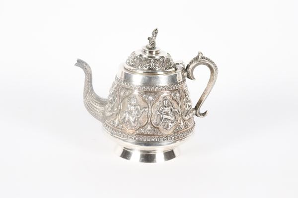 Indian silver coffee pot, Colonial Period, entirely chiseled and embossed with figures of deities, gr. 350