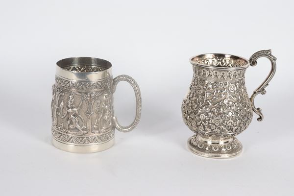 Lot of two small oriental silver jugs, Colonial Period, chiseled and embossed with floral motifs and figures of deities, gr. 350