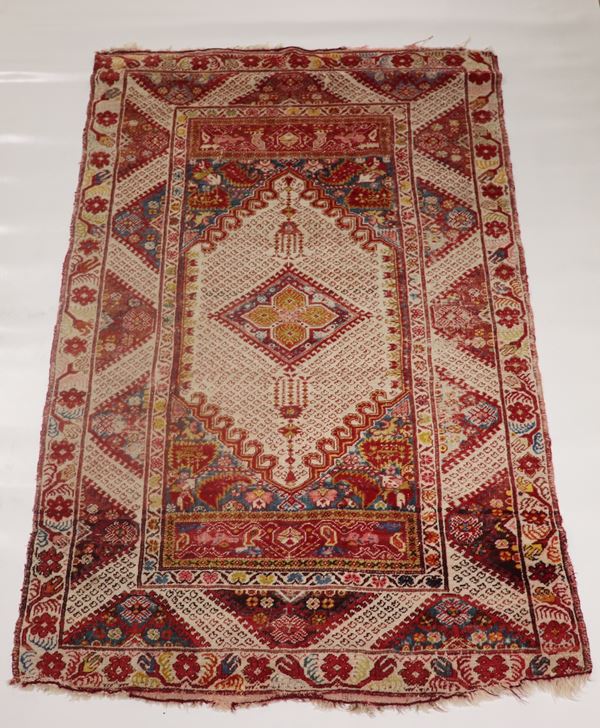 Persian rug with geometric design in Havana on a red background