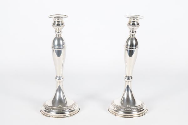 Pair of candlesticks in 925 silver, chiseled and embossed with Empire motifs, 100 g