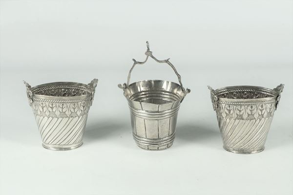 Three small silver buckets