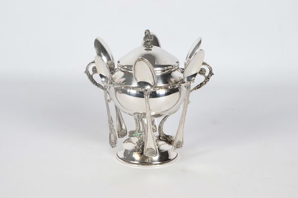 Silver sugar bowl in the shape of an amphora with six teaspoons, supported by three small dolphin sculptures on a round base, 280 g