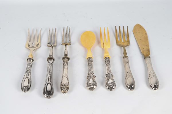 Lot of seven antique serving cutlery with handles covered in chiselled and embossed silver, one salad server has a defect