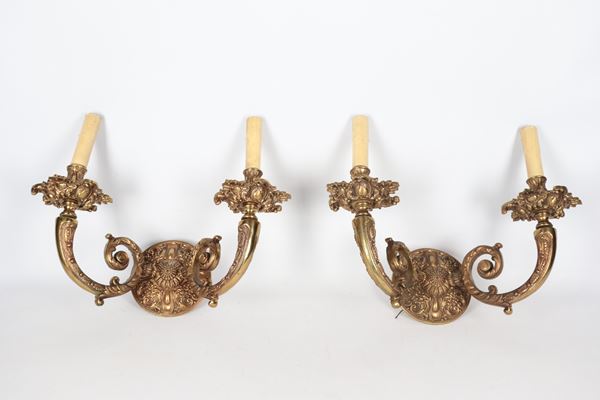 Pair of antique French Napoleon III gilded bronze wall lamps, entirely chiseled and embossed with scroll, flower and leaf motifs, 2 lights each