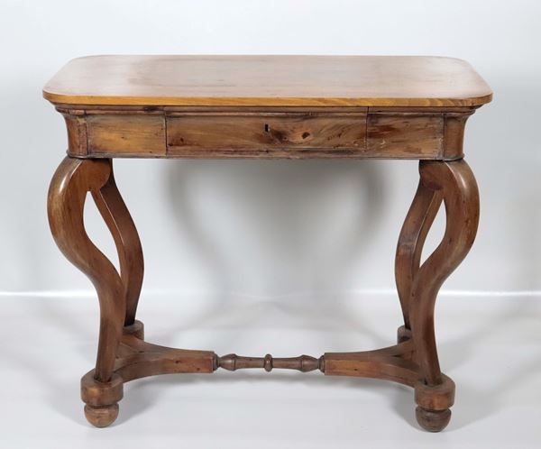 Antique walnut coffee table from the Directoire style, rectangular in shape with a central drawer and four legs joined by a crosspiece underneath 