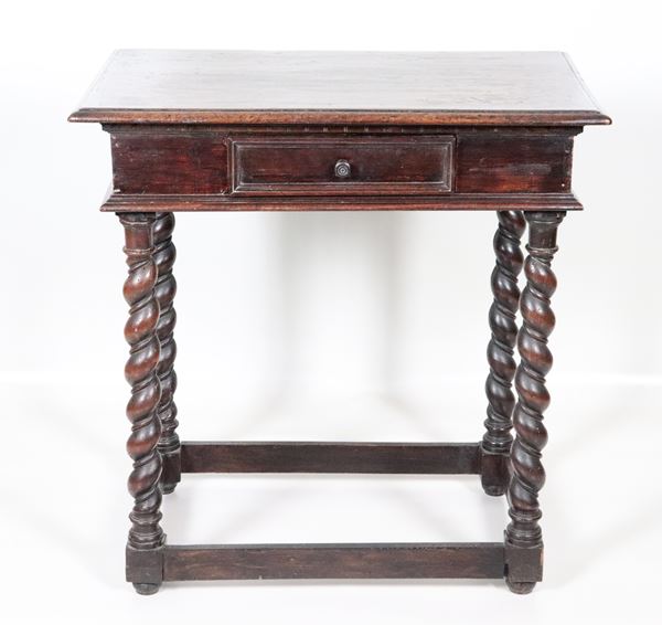 Antique small Bolognese walnut centre table, rectangular in shape with central drawer and four twisted legs joined by a rectangular band