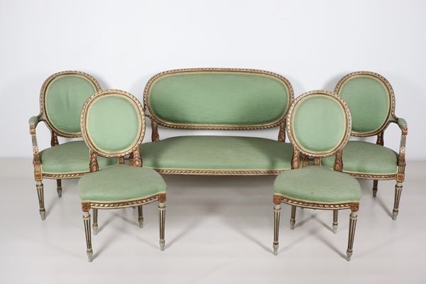 French living room in gilded wood and ivory lacquer, with Louis XVI motif carvings, green fabric covering: sofa, two armchairs and two chairs (5 pcs.)