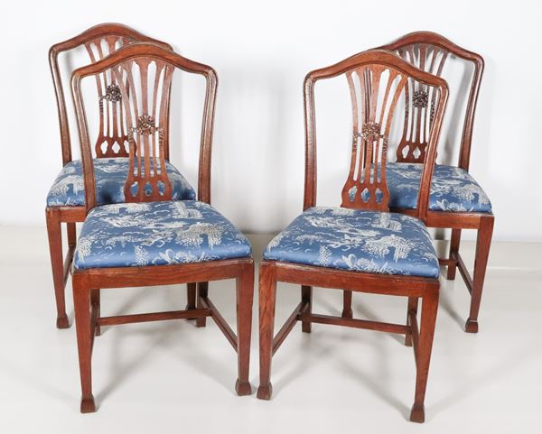 Lot of four antique English mahogany chairs, with carved and perforated backrests, covered in worked blue fabric