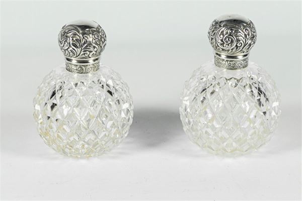 Pair of crystal perfume bottles with silver lids
