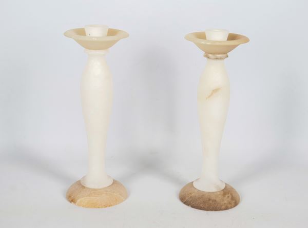 Pair of Liberty alabaster candlesticks, one candlestick has a small defect on the upper edge