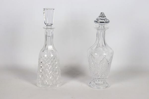 Lot of two diamond-pointed crystal bottles, different shapes. One bottle has a slight chip on the edge of the neck