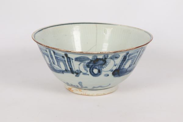 Antique Chinese porcelain bowl with blue oriental motif decorations, defects and breakage. Early 19th century