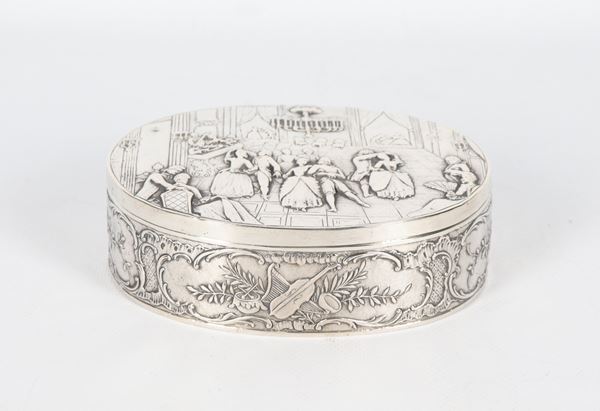 Antique French silver box, entirely chiselled and embossed with floral scroll motifs and musical instruments, on the lid a scene with the nobles&#39; dance, 340 g. Paris stamps, early 19th century