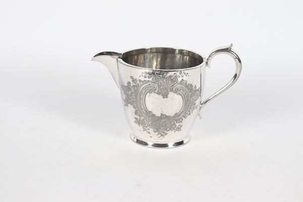 Antique English Victorian milk jug, in chiseled and embossed Sheffield with floral scrolls