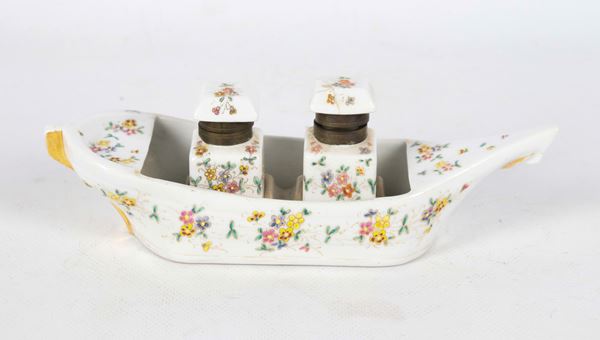 Porcelain inkwell in the shape of a reed, with polychrome decorations of raised enamels with floral motifs, two bottles, one of which has a broken lid