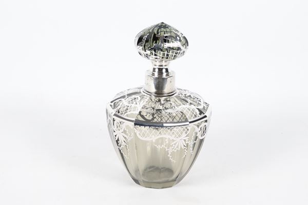 Liberty liquor bottle in smoked crystal, with silver applications of floral scroll motifs