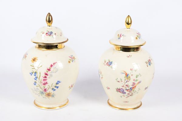 Pair of German Bavarian porcelain potiches, with polychrome decorations painted in relief with exotic flower and bird motifs