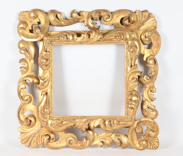 Antique Roman frame in gilded wood and carved with Louis XV motifs