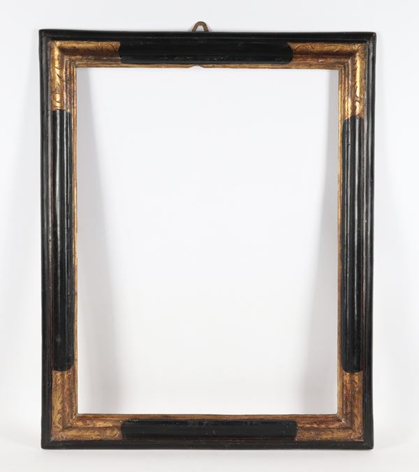 Antique ebonized wooden frame with gilded corners and graphite