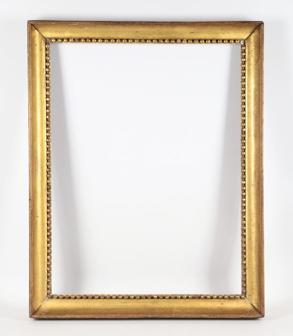 Antique Empire frame in gilded wood with beaded edge