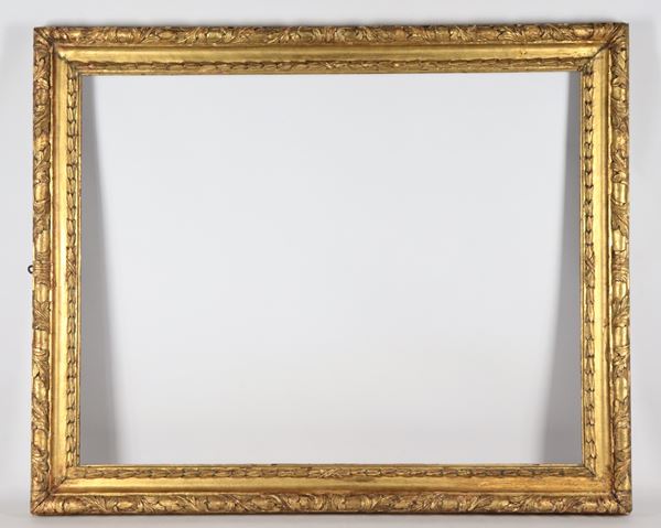 Antique gilded wooden frame carved with interlacing and palmette motifs